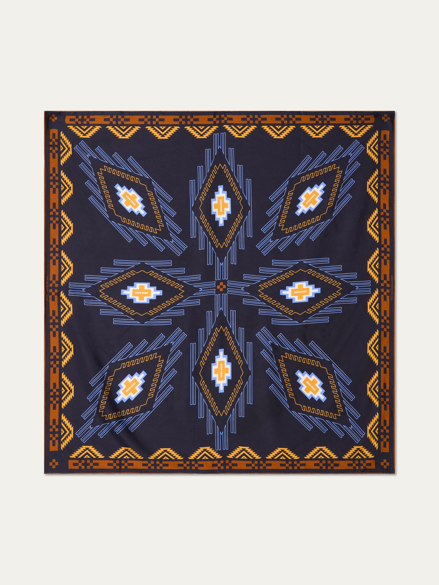 We Norwegians | FW25 | Pioneer Silk Scarf_Navy blue | Scarf with printed motifs | Shot against an off-white background